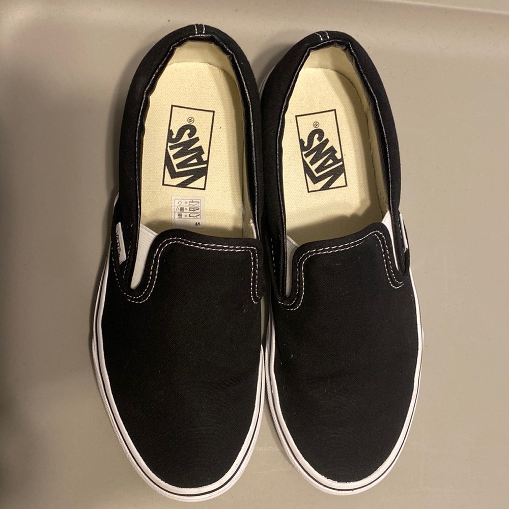 Vans Slip on- Black with White trim. Women’s 8/ Men’s 6.5